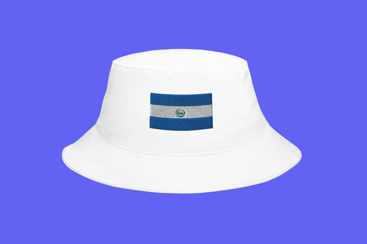 White bucket hat with a blue and gray logo on a blue background